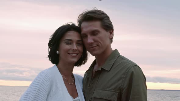 Portrait of Happy Couple on Ocean Coast alt