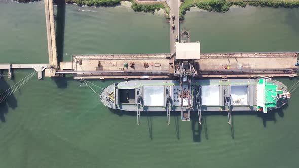 Container cargo freight ship at landmark Santos harbor port Brazil. alt