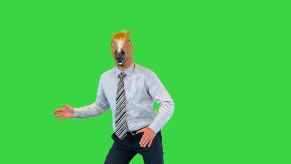 Funny Businessman in Horse Mask Dance in Office During Break to Cheer Up Colleagues at Workplace on