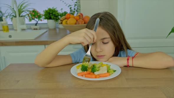 The Child Eats Boiled Vegetables alt