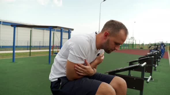 Male Fitness Model Doing Sit Ups and Crunches Exercising Abdominal Muscles Outside alt