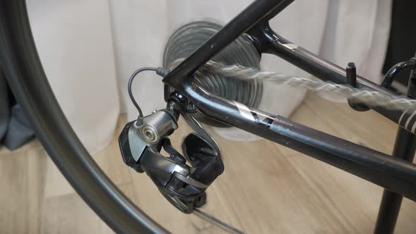 Bicycle wheel and bike gear in motion. Bike wheel rotate. Cycling gear and tire. alt