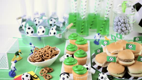 Kids football party set with snacks and drinks. alt