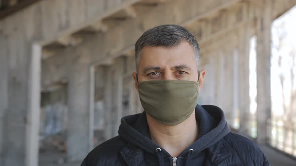 Portrait of a Man in a Medical Mask alt