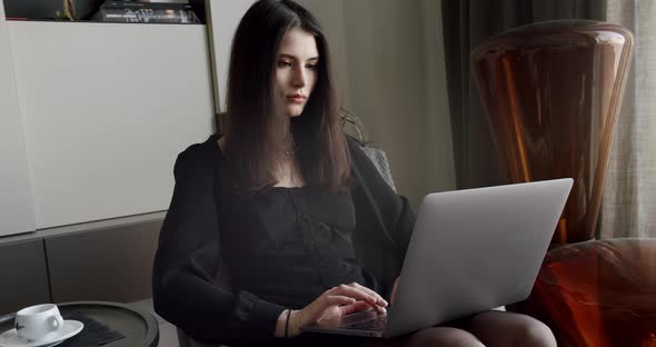 Young Adult Business Woman Typing on Laptop Computer Working in Internet alt