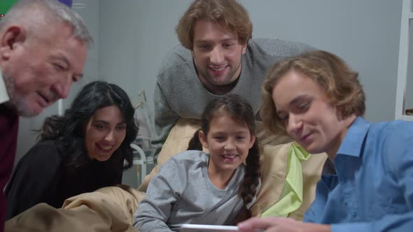 Slow Motion, Relatives Visit Girl in the Hospital, Boy Show Funny Photo To Everyone alt