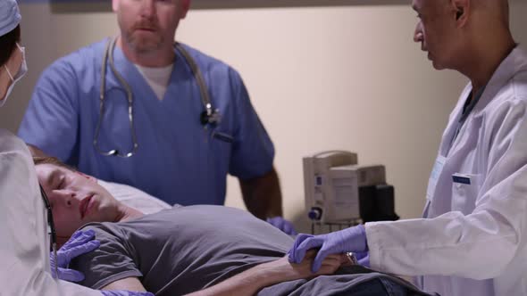 Man with head injury is examined by doctors