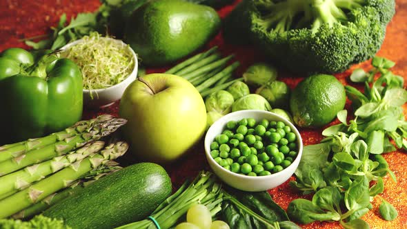 Fresh Green Vegetables and Fruits Assortment Placed on a Rusty Metal alt