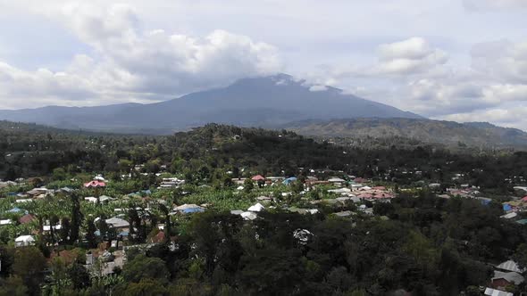 Incredible Aerial Shot Flying Towards Mount Meru Over Arusha Town Tanzania alt