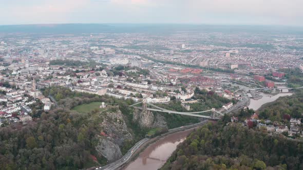 High circling drone shot over central Bristol and the clifton suspension bridge alt
