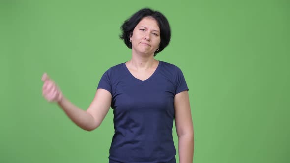 Beautiful Woman with Short Hair Giving Thumbs Down alt