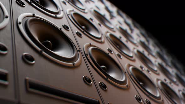 Modern speakers stacked in an endless wall loop. Membranes vibrate, studio mood. alt