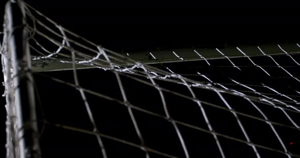 Soccer ball in goal post against goalkeeper 4k alt