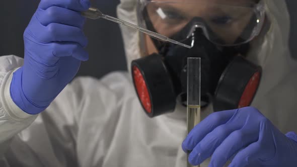 Toxic Laboratory Worker Carefully Taking Sample of Infected With Virus Water alt