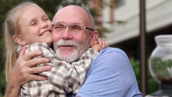 Grandpa Hugging Granddaughter