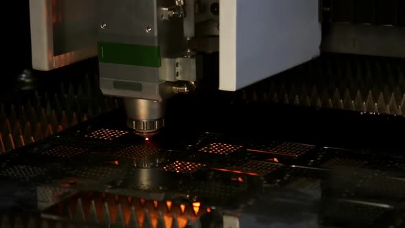 Laser Cutting and Metal Sparks Processing on a CNC Machine