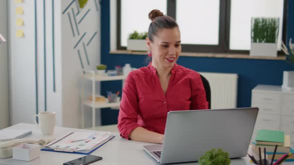 Company Accountant Working with Financial Statistics on Laptop alt