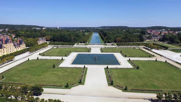 Aerial View of Medieval Landmark Royal Hunting Castle Fontainbleau and Lake with White Swans, France