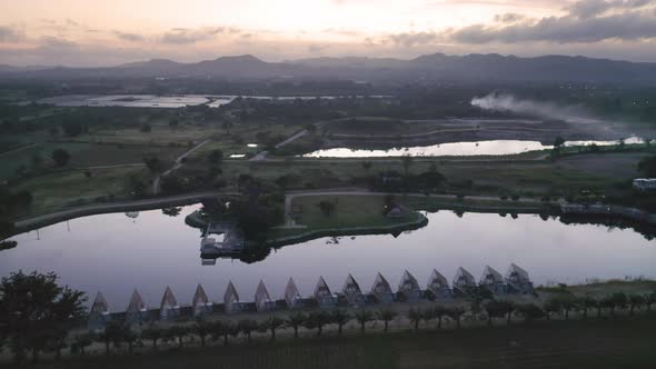 Aerial view of home, house or resort under contruction with lake or river with reflection alt