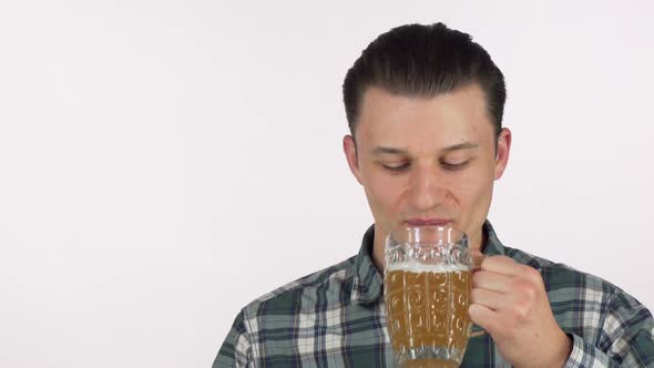 Happy Young Man Looking Excited, Drinking Delicious Beer, Smiling Happily alt