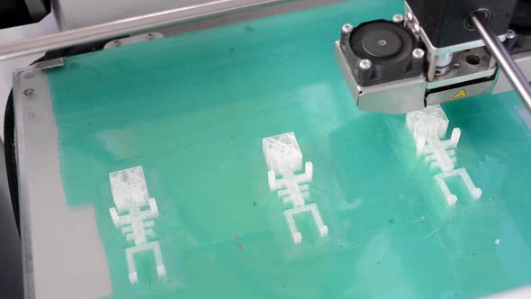3D Printer Working and Creating an Object From the Hot Molten Plastic alt