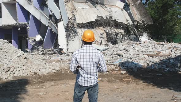 Demolition control supervisor or engineer on demolish building.