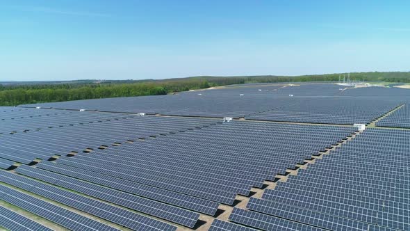 Aerial View of Solar Power Station Field at Sunny Day. Aerial Top View of Solar Farm. Renewable