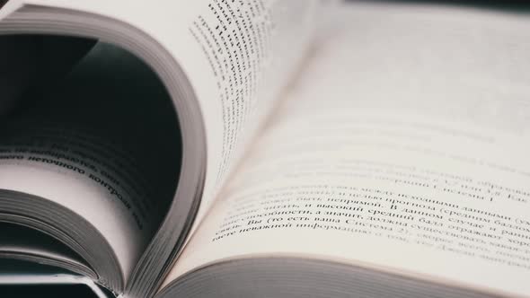 Turning Pages of a Book CloseUp Slow Motion alt