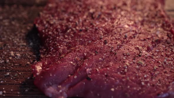 Mixed Pepper and Spices on the Raw Meat Steak alt