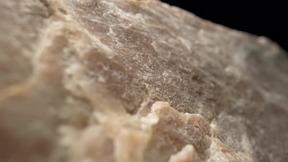 Solid Piece of Granite or Quartz Stone Against Black Background alt