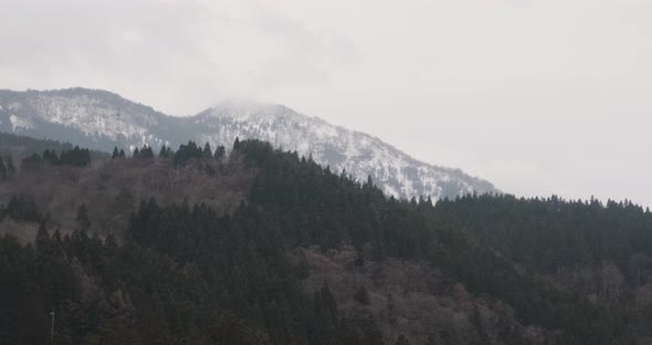 Moving Scenery of Mountains and Forest Seen From Train Window. Beatiful View of Japan Nature alt