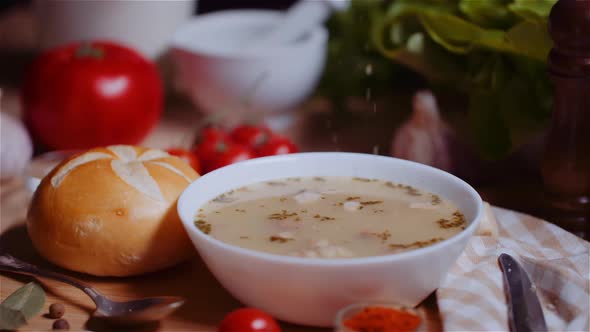 Soup In Bowl Amidst Various Ingredients Assorted On Wooden Table alt
