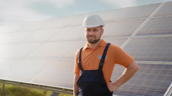 Portrait of Ecological Expert Industrial Worker in Uniform Standing By Solar alt