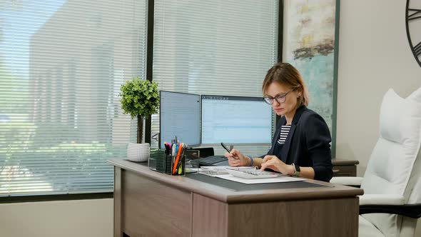 Woman Sit at Desk Using Computer Make Data Analysis Check Statistics Research Workday in Office alt