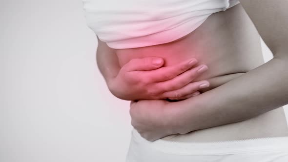 Young Woman Experiencing Stomach Pain