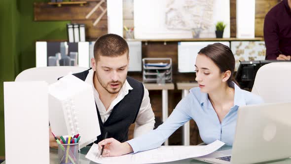 Happy Young Architect About Their Project and Giving Hi5 To Each Other alt