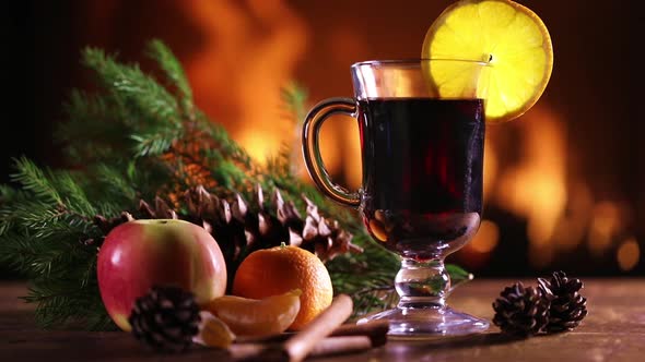 A Glass of Mulled Wine With Fruit And Pine Branches