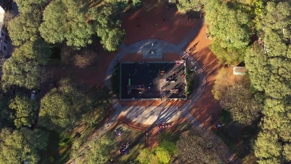 Playground square, children family animals, city springtime, drone bird's eye view . alt