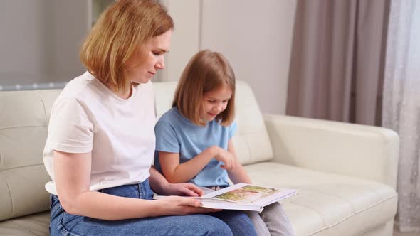Mother and Daughter Watch Photobook Family Photo Shoot in Spring Garden alt