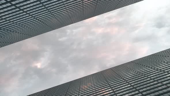 Airplane Flies Over Office Skyscrapers Against a Beautiful Sky alt