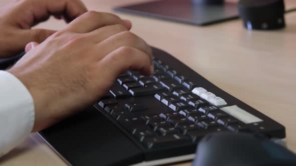 Hands Of Staff Typing And Calculating On The Keyboard alt
