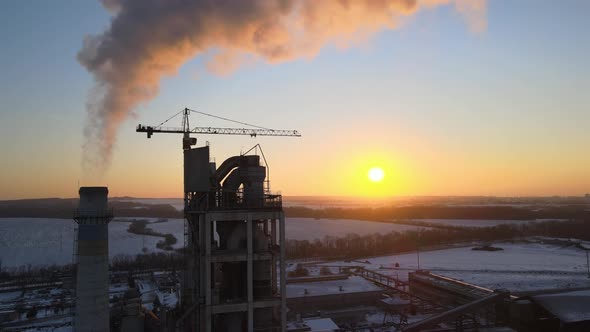 Aerial View of Cement Factory with High Concrete Plant Structure and Tower Crane at Industrial alt