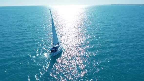 Aerial View. Big Sailing Yacht Boat Driving Thru the Ocean on a Sunny Day