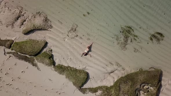 Top View of a Girl Lying on Beach