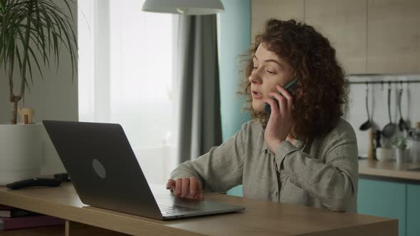 Young 20s Adult Student Opening a Laptop and Begin Working in Her Kitchen alt