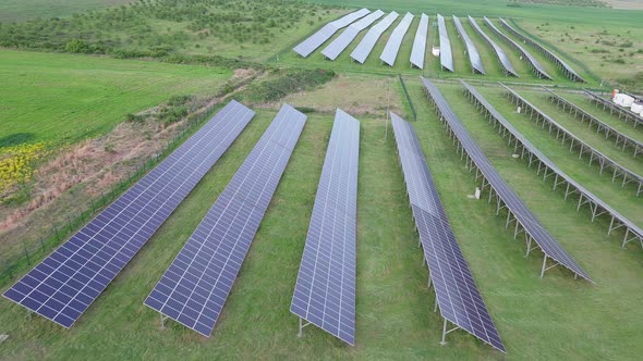 Solar Panels to Generate Energy From the Sun's Rays are Installed in the Meadows Under a Blue Sky
