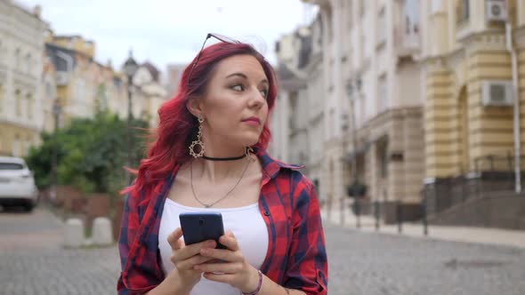 Red Hair Girl Use Blue Smartphone