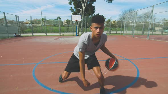 Black athlete dribbling and shooting basketball ball alt