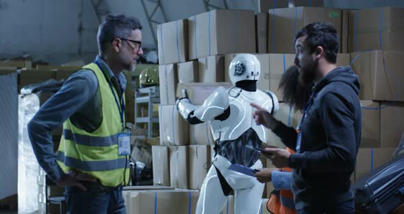 Engineers Evaluating a Robots Work alt