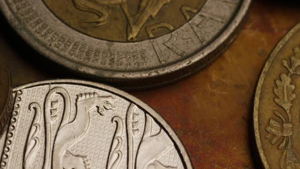 Rotating stock footage shot of international monetary coins alt